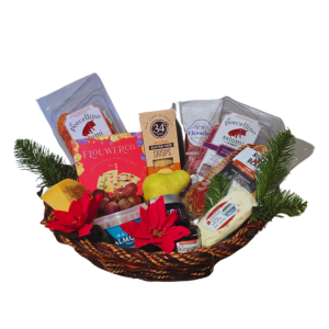 A gourmet office charcuterie basket featuring 99% Colorado-made products, including Ill Porculino Salami and Braeseola, River Bear Lomo, James Ranch Belford Cheese, Yoder Ranch Goat Cheese, Red Camper Mostarda, Jay Primo Fruit Paste, fresh fruit, Marcona 