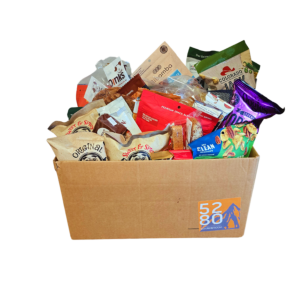 Large Colorado Snack Box featuring 50 servings of local favorites like Oogie's Popcorn, Chocolove, Colorado Jack Popcorn, Bibamba, Colorado Fudge, Enstrom Toffee, Gnarly Mountain Cookies, and more. Perfect for office snacks or gifting, available at 5280Go